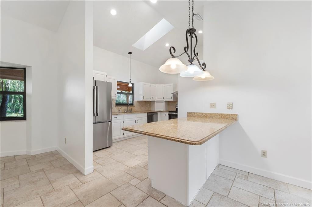 5820 SW Grove Street, Palm City, FL 34990 Peninsula for extra counter and cabinet storage.