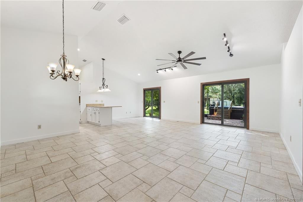 5820 SW Grove Street, Palm City, FL 34990 Great room with two impact sliders.