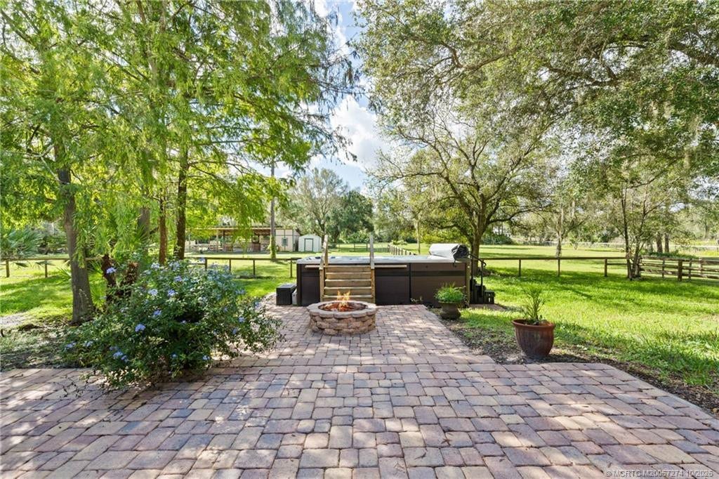 5820 SW Grove Street, Palm City, FL 34990 Paver patio with fire pit and swim spa.