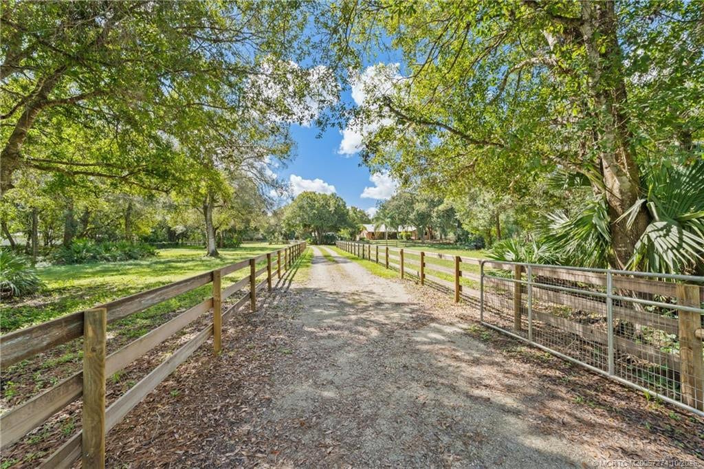 5820 SW Grove Street, Palm City, FL 34990 Entry driveway with gate.
