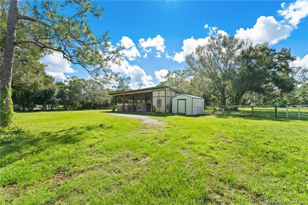 5820 SW Grove Street, Palm City, FL 34990 # stall barn with storage building.