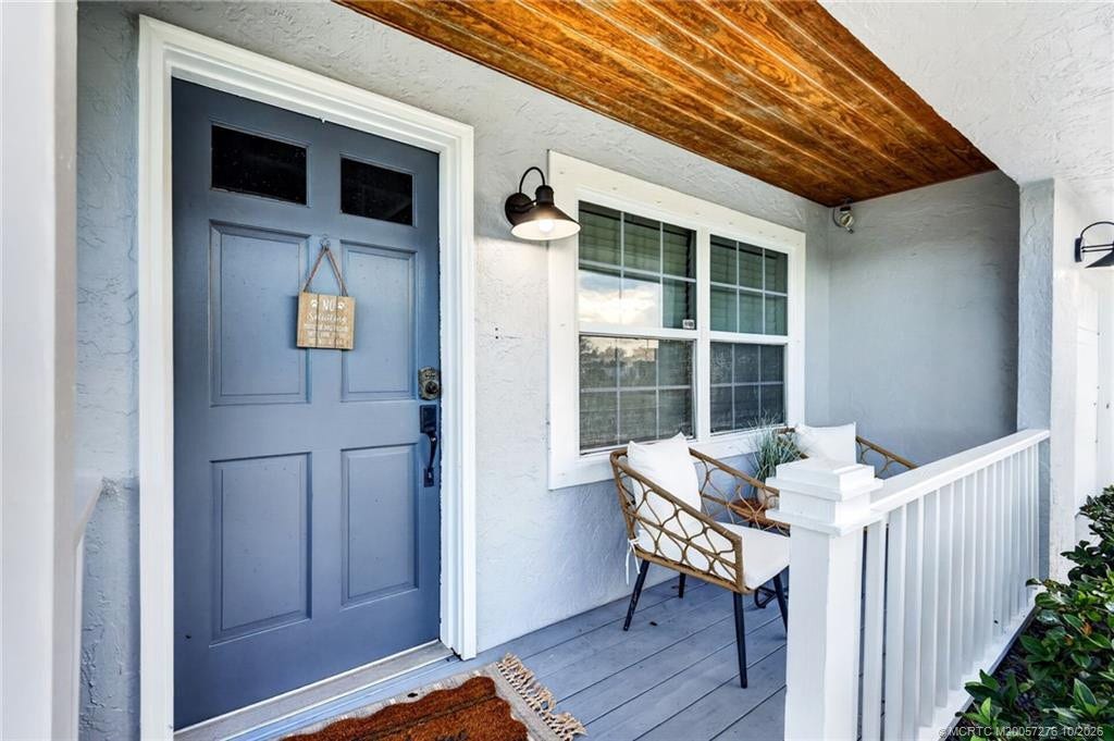 2657 SW Harem Circle, Port St Lucie, FL 34953 Greet your guests from this welcoming front porch with warm wood ceiling.