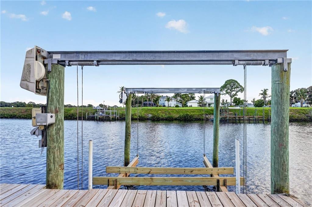2657 SW Harem Circle, Port St Lucie, FL 34953 12,000 pound boat lift. Bunks replaced in 2026