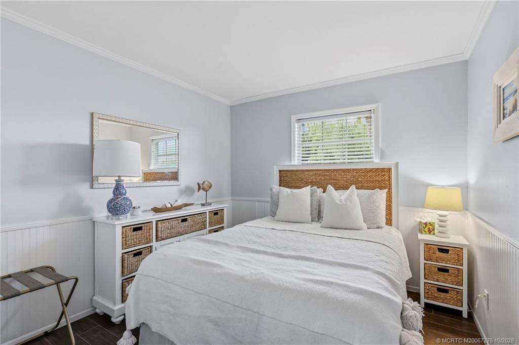 2657 SW Harem Circle, Port St Lucie, FL 34953 Comfortable guest bedroom featuring soft coastal tones, wood-look flooring