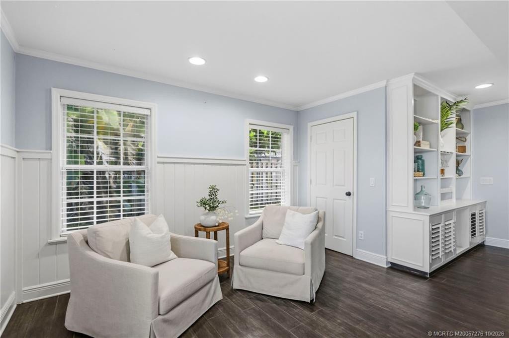 2657 SW Harem Circle, Port St Lucie, FL 34953 A cozy sitting area within the family room with custom built-ins creates a welcoming retreat for reading or conversation