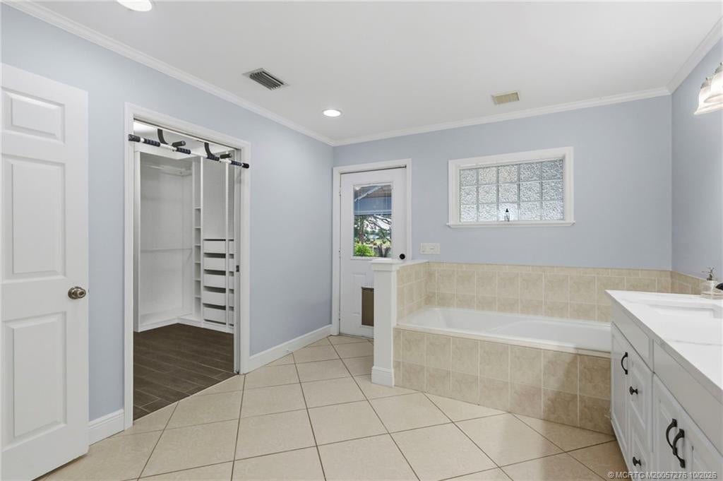 2657 SW Harem Circle, Port St Lucie, FL 34953 Walk-in closet and door to the patio