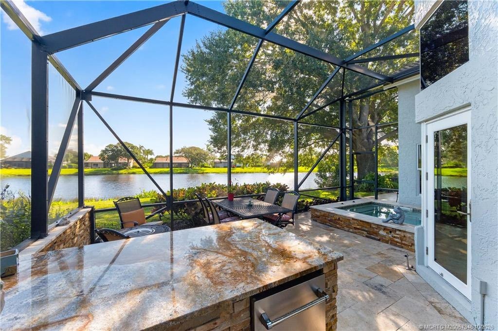 1642 NW Sweet Bay Circle, Palm City, FL 34990 Screen Enclosed Patio w/Outdoor Kitchen & Spa