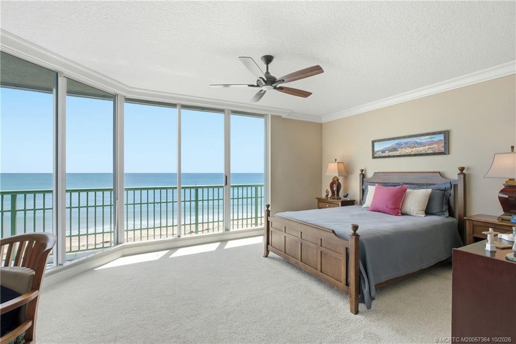 Oceanfront primary suite offers panoramic water views, abundant natural light, and plenty of room to relax.