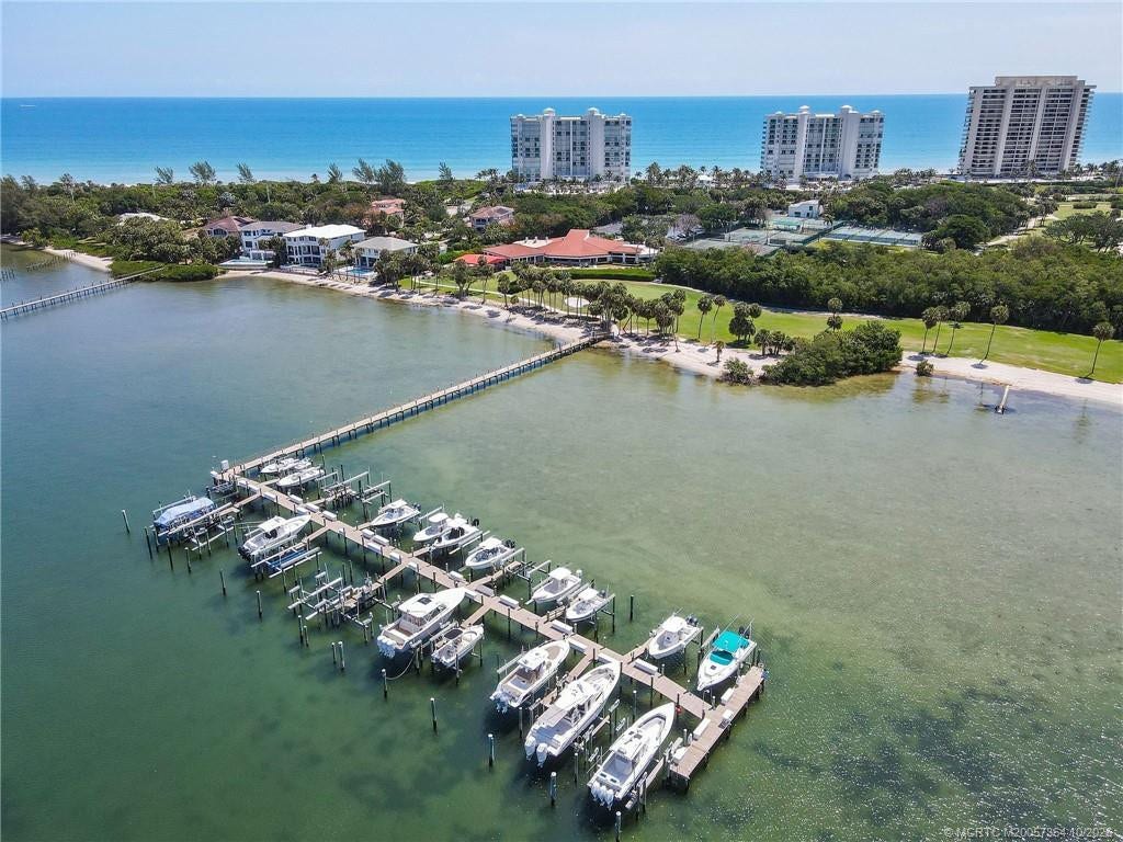 Beautiful aerial view of the Island Dunes Country Club marina, nestled along the Indian River with convenient access to the Intracoastal Waterway. A picturesque setting for enjoying the Treasure Coast boating lifestyle.