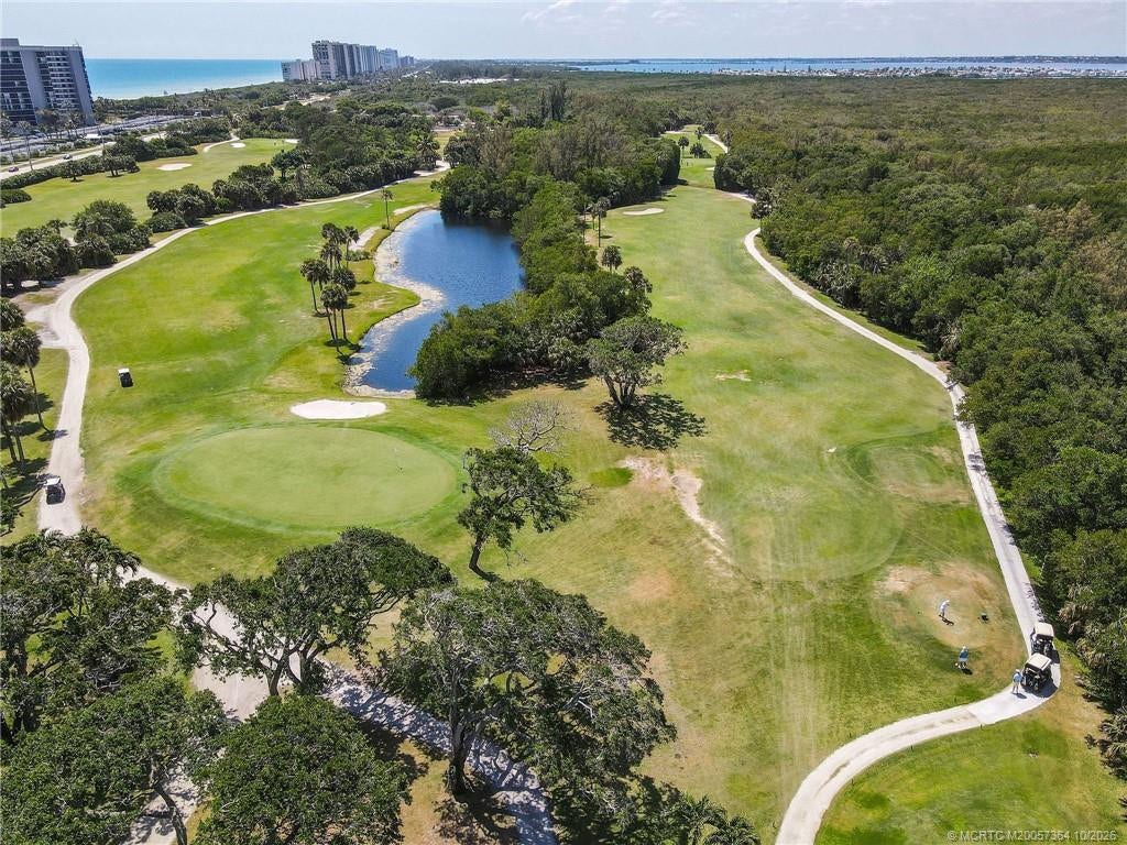 Enjoy the beautifully landscaped 9-hole golf course at Island Dunes Country Club, featuring lush fairways, scenic ponds, and a peaceful natural setting.