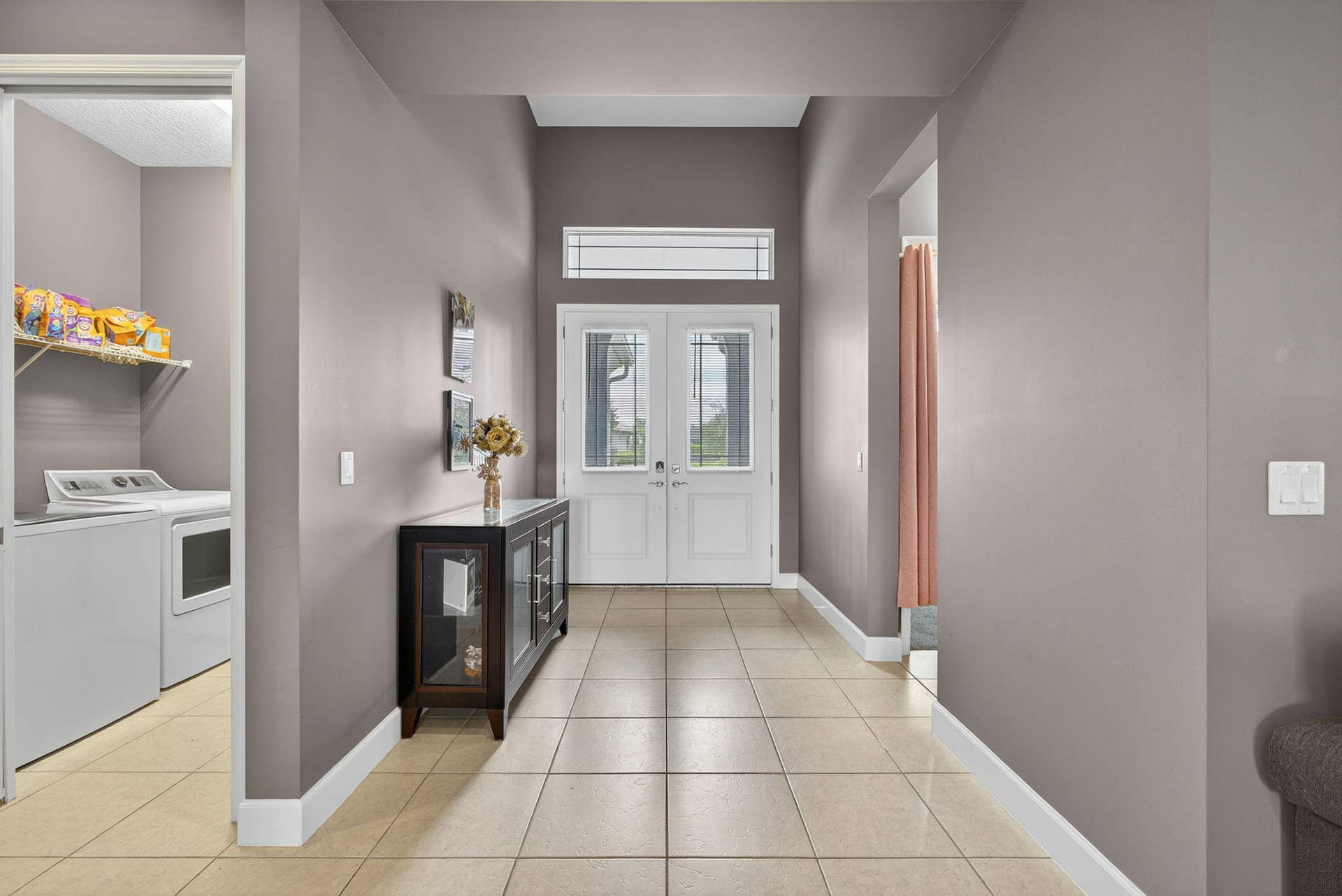 Long hallway with one bedroom off to the other side