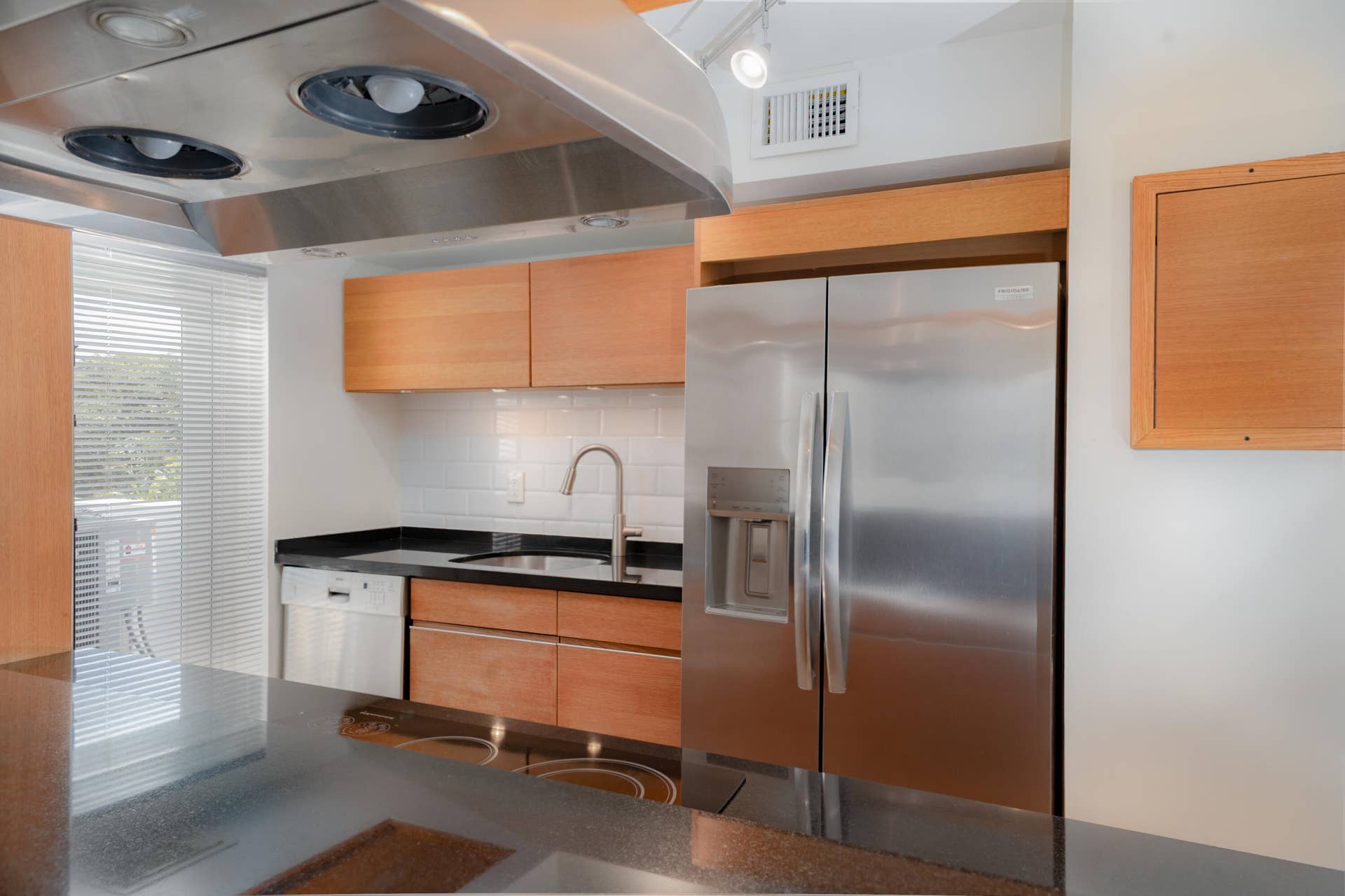 SS + granite + white metro backsplash tile = a winning combination