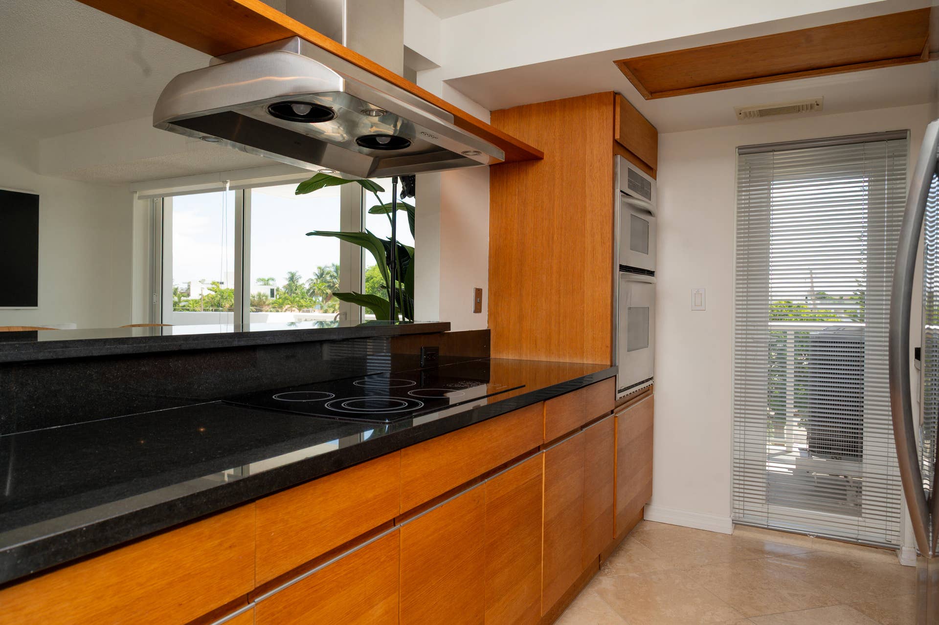 Kitchen provides dirrect access to balcony