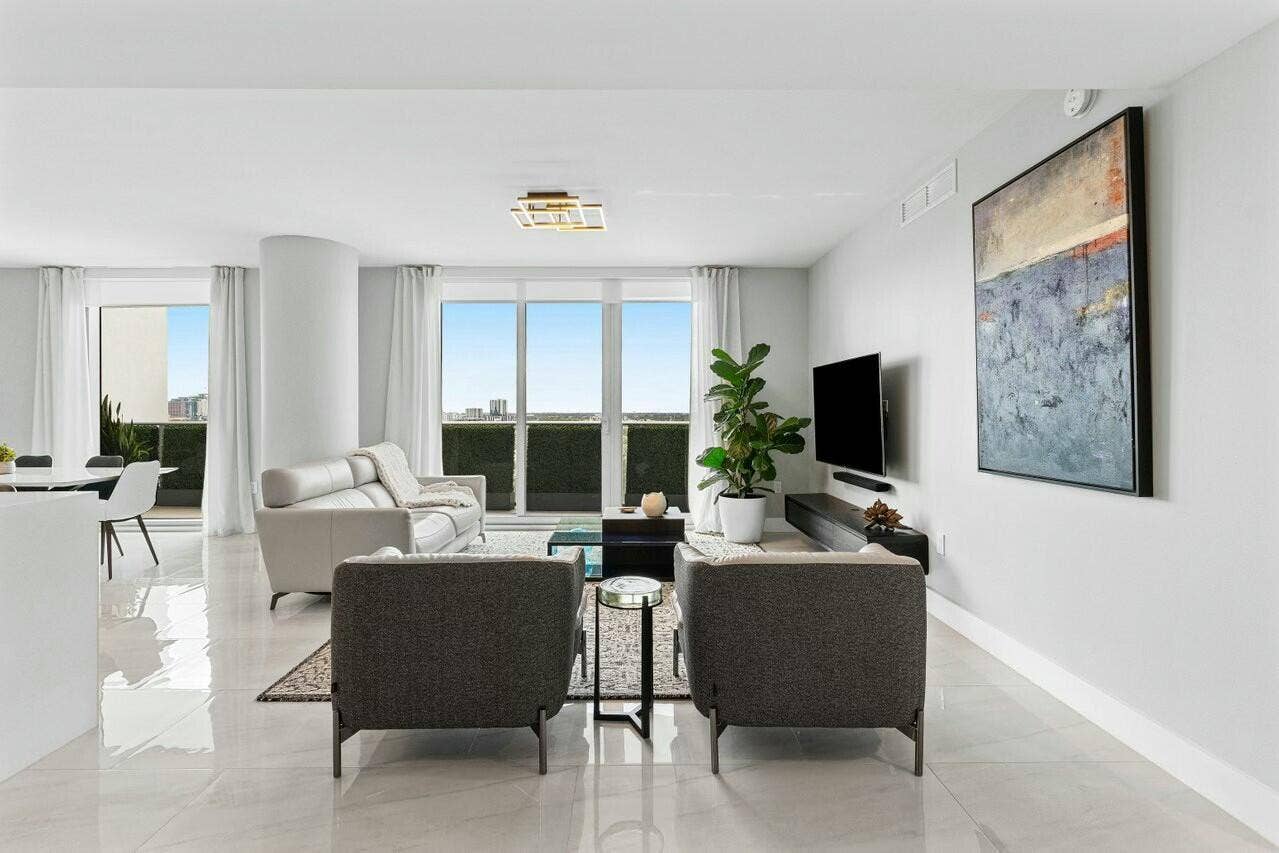 1180 N Federal Highway, #1409, Fort Lauderdale, FL 33304 Spacious Living Room with Access to the Oversized Balcony, 10ft Ceiling, Floor to Ceiling Impact Sliding Glass Doors. Unobstructed City Views