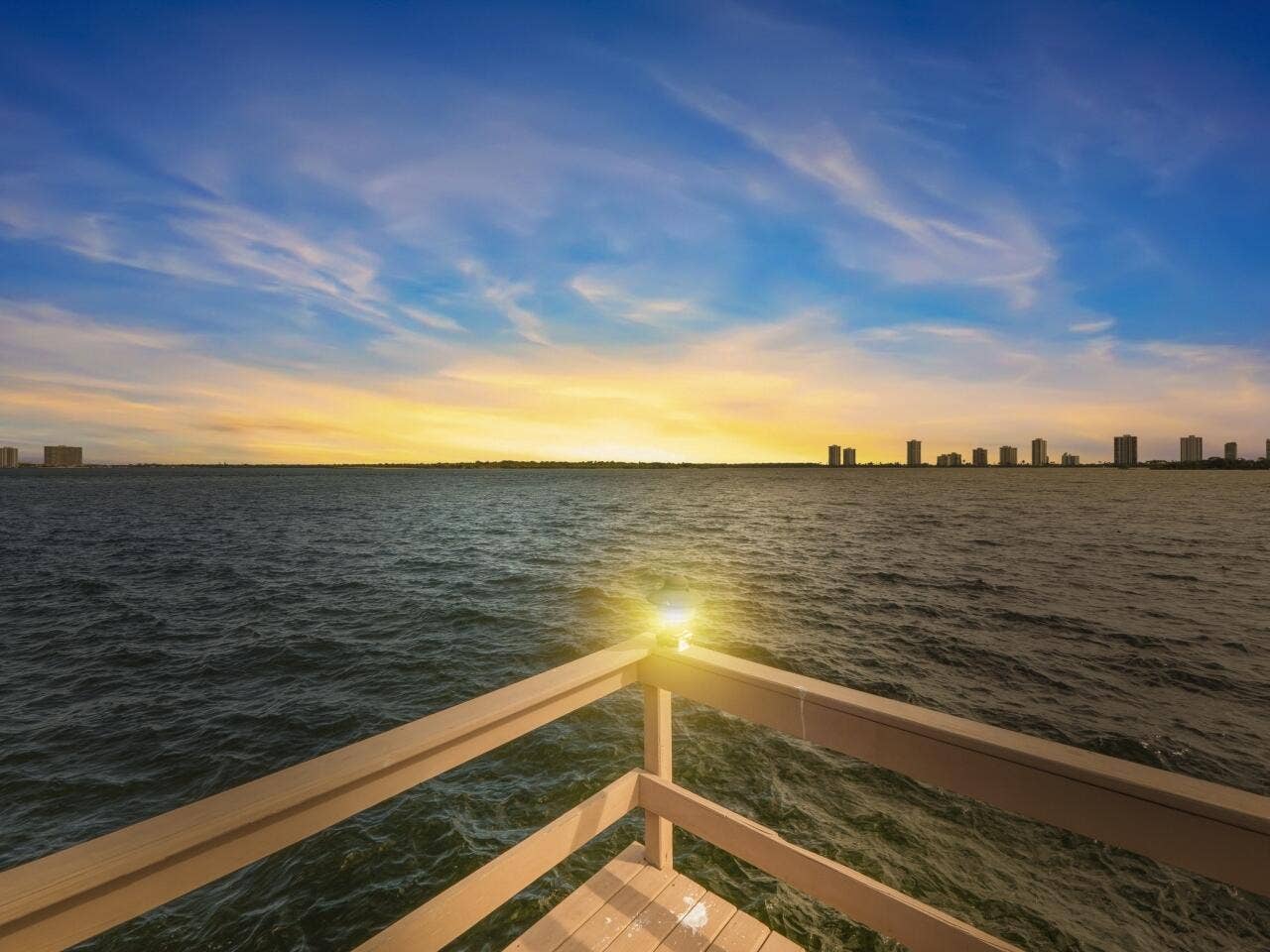 101 Doolen Court, #201, North Palm Beach, FL 33408 Twilight View of Water & Singer Island
