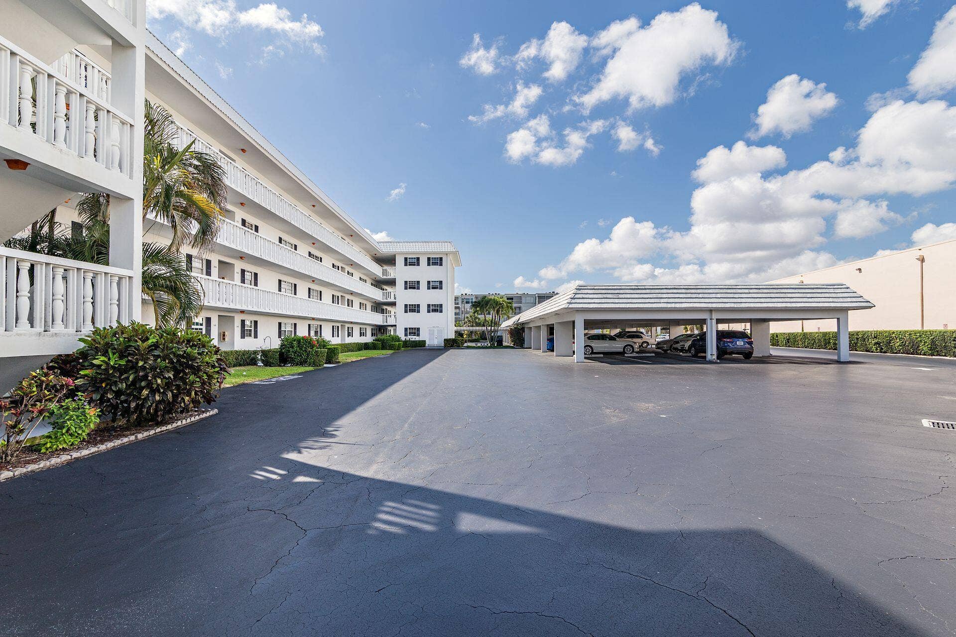 907 Marina Drive, #402, North Palm Beach, FL 33408 back of Harbour Towers with carport