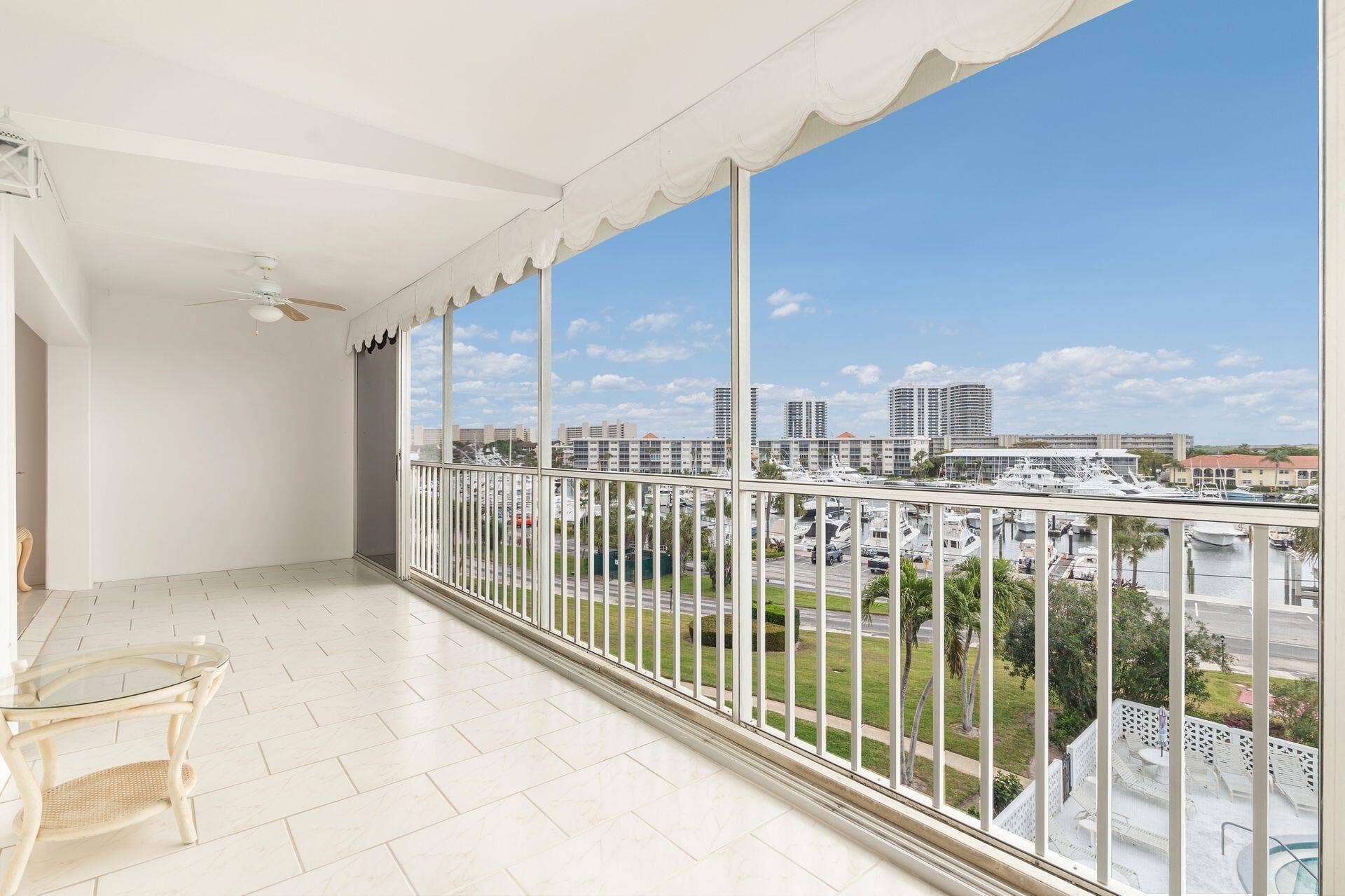 907 Marina Drive, #402, North Palm Beach, FL 33408 cover glass & screen patio the length of entire apt with views of marina & intracoastl