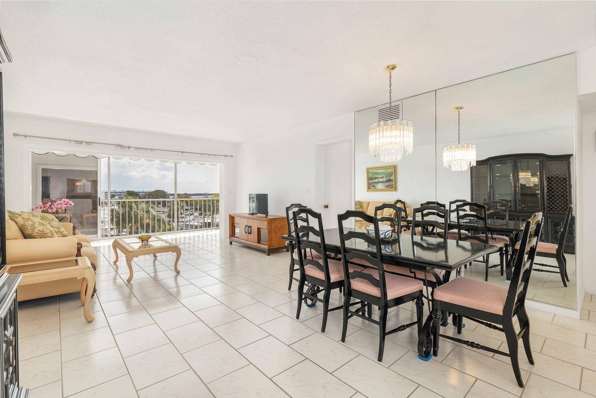 907 Marina Drive, #402, North Palm Beach, FL 33408 spacious living & dining room to open patio to watch the boats go by