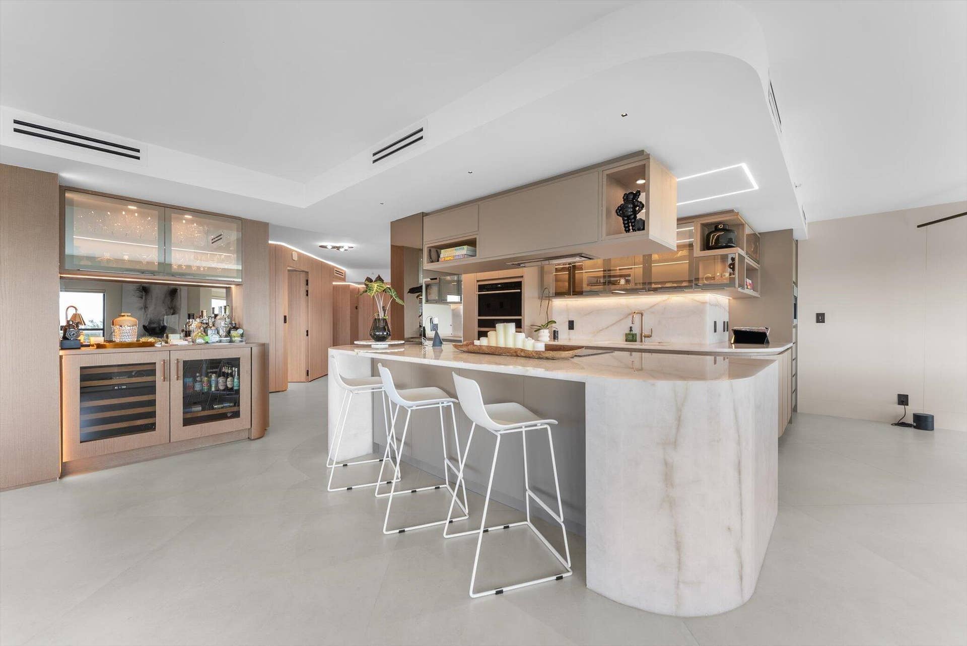 Custom Designed Island, Countertops, and backsplash: Cristallo Quartzite