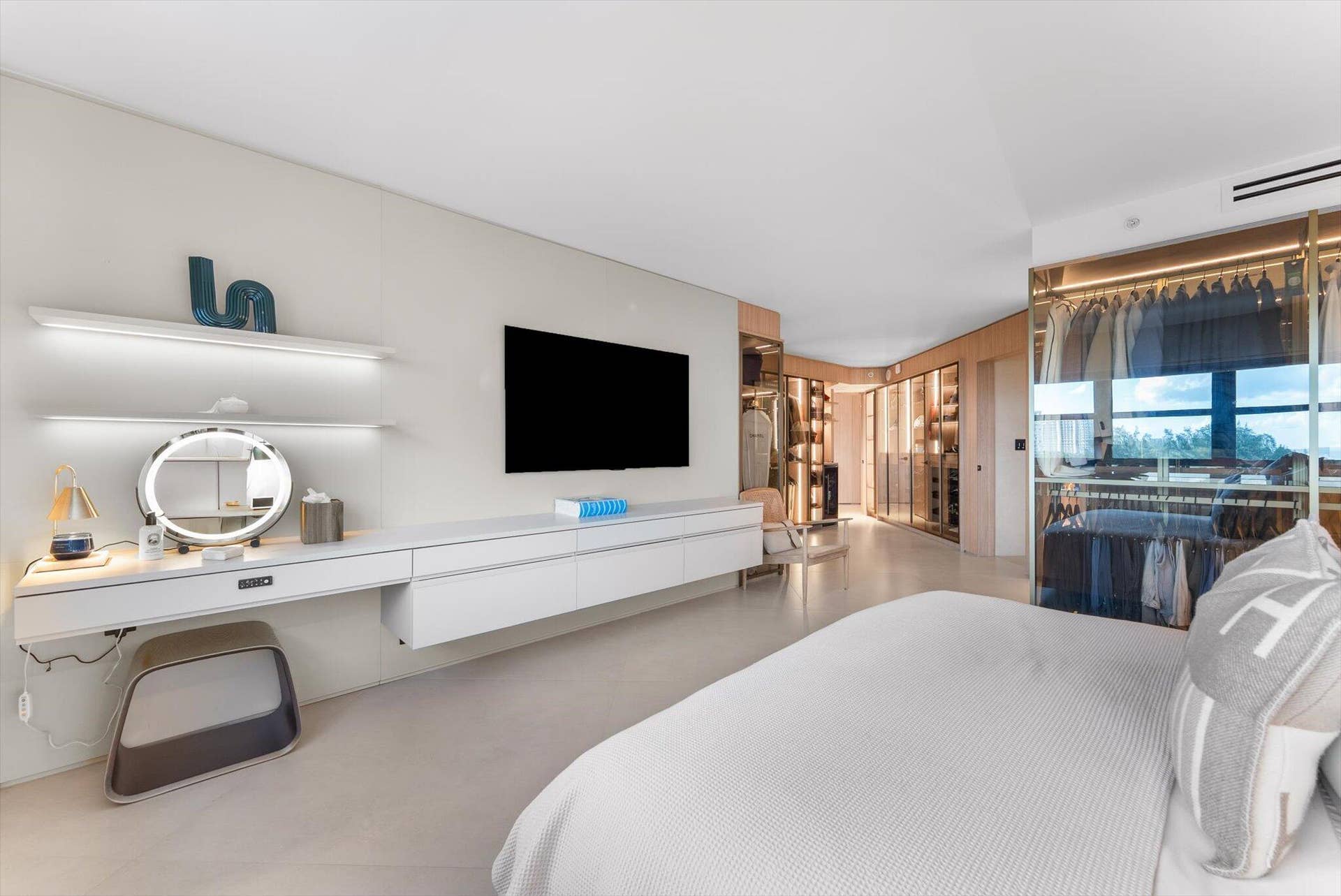 Primary Suite - A Symphony of Glass, Lighting, Millwork, and Custom Design that rivals any five star resort.