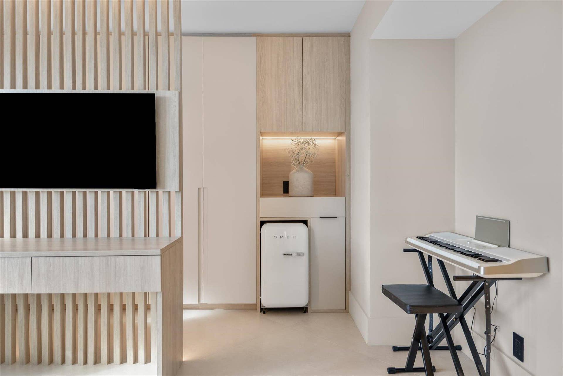 Guest Suite with Beverage Area and Smeg Refigerator and Custom Wood Design Desk