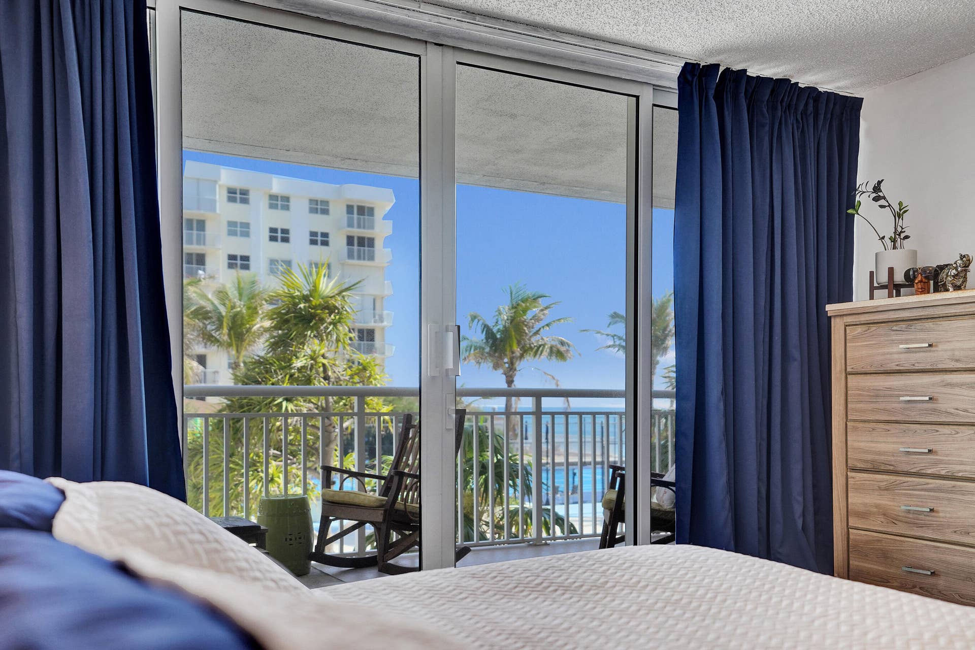 3546 S Ocean Boulevard, #327, South Palm Beach, FL 33480 Sliders to the balcony with sitting area for Primary Suite