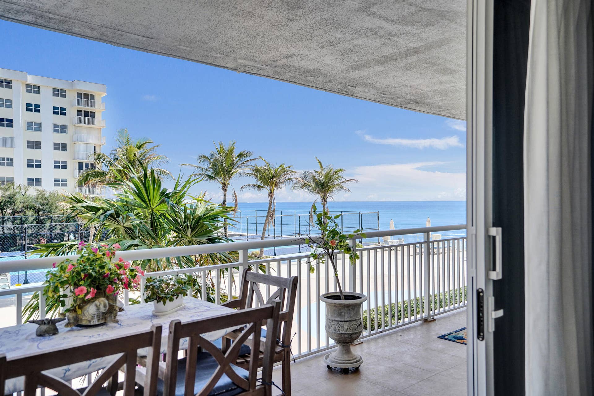 3546 S Ocean Boulevard, #327, South Palm Beach, FL 33480 This terrace/balcony is an entire outdoor living space with sitting areas off each set of sliders, bedrooms and living room