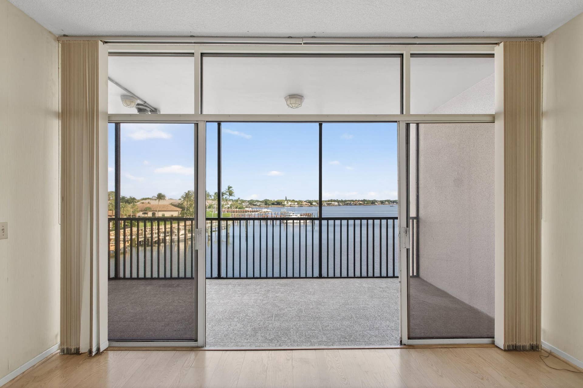 11390 TWELVE OAKS Way, #420, North Palm Beach, FL 33408 Living Room entry to Balcony