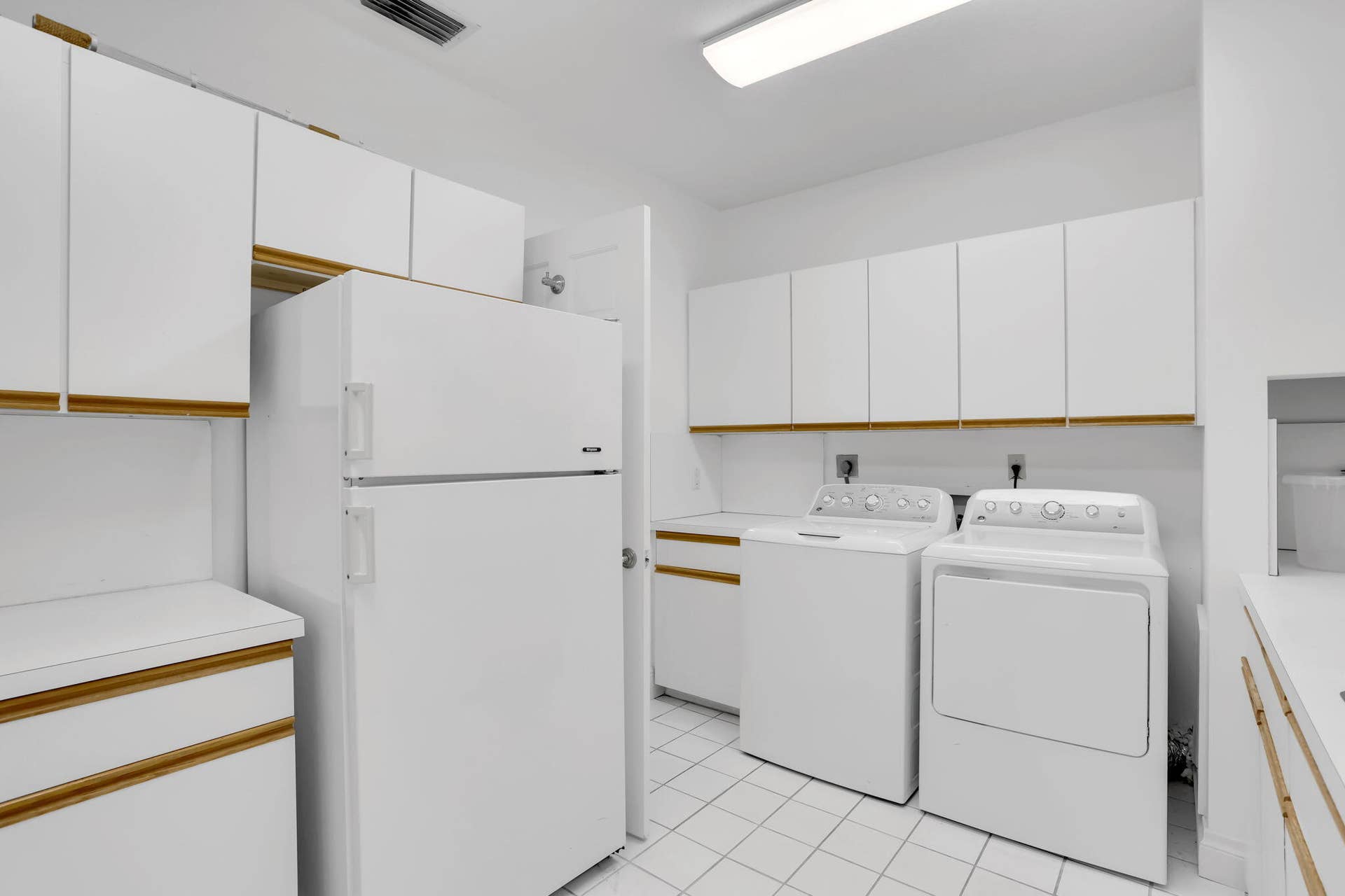 2883 Banyan Boulevard Circle NW, Boca Raton, FL 33431 Laundry room with refrigerator