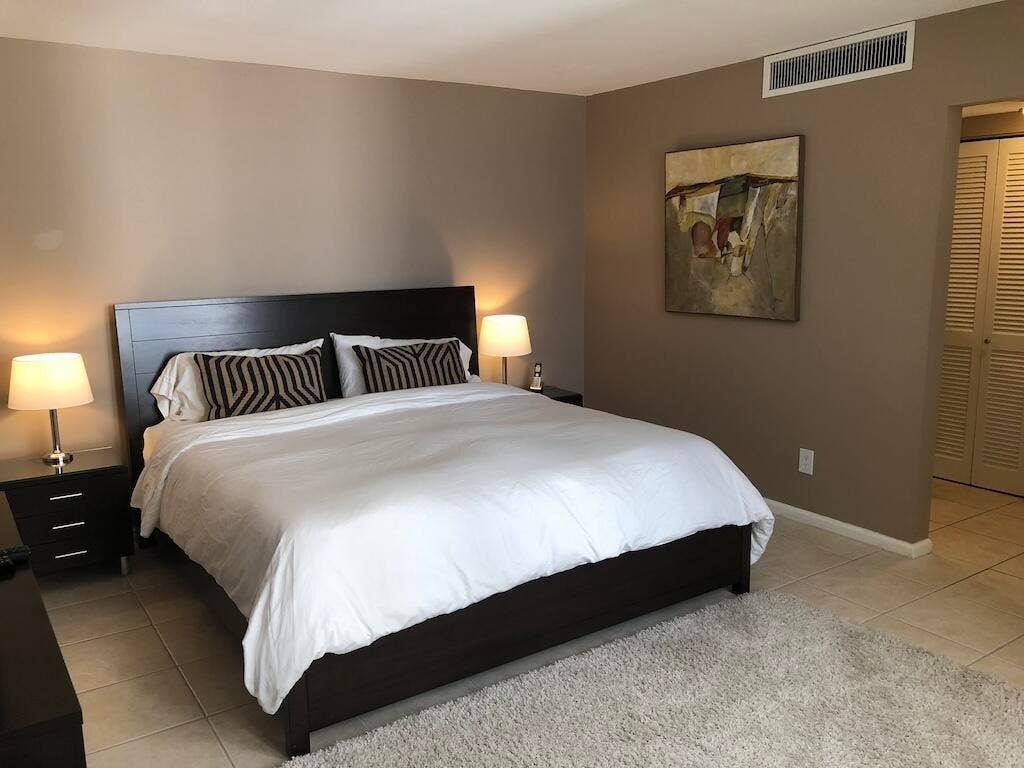 Neutral-toned walls complement the tile flooring