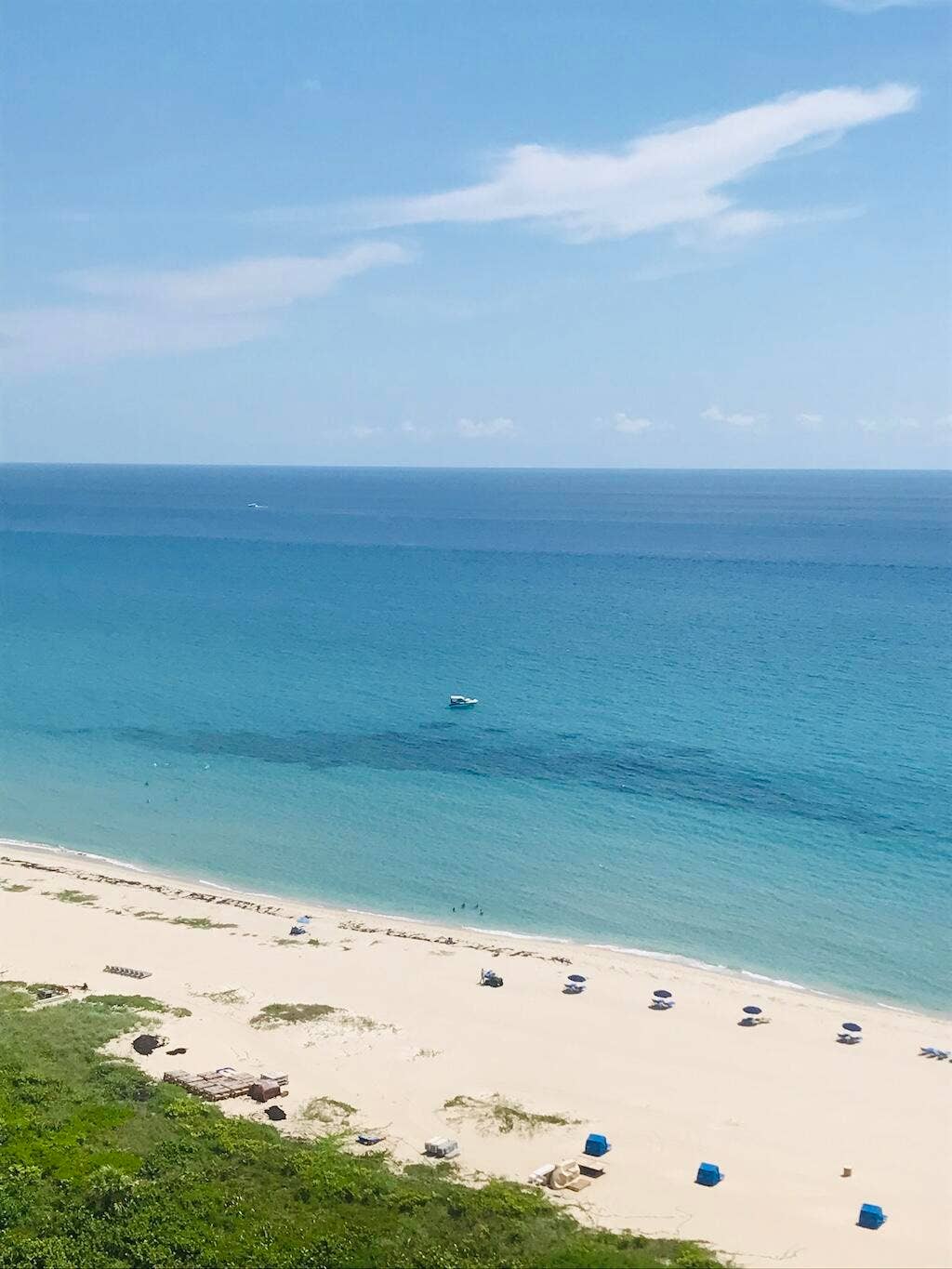Expansive ocean and beach scenery featuring a wide sandy shore