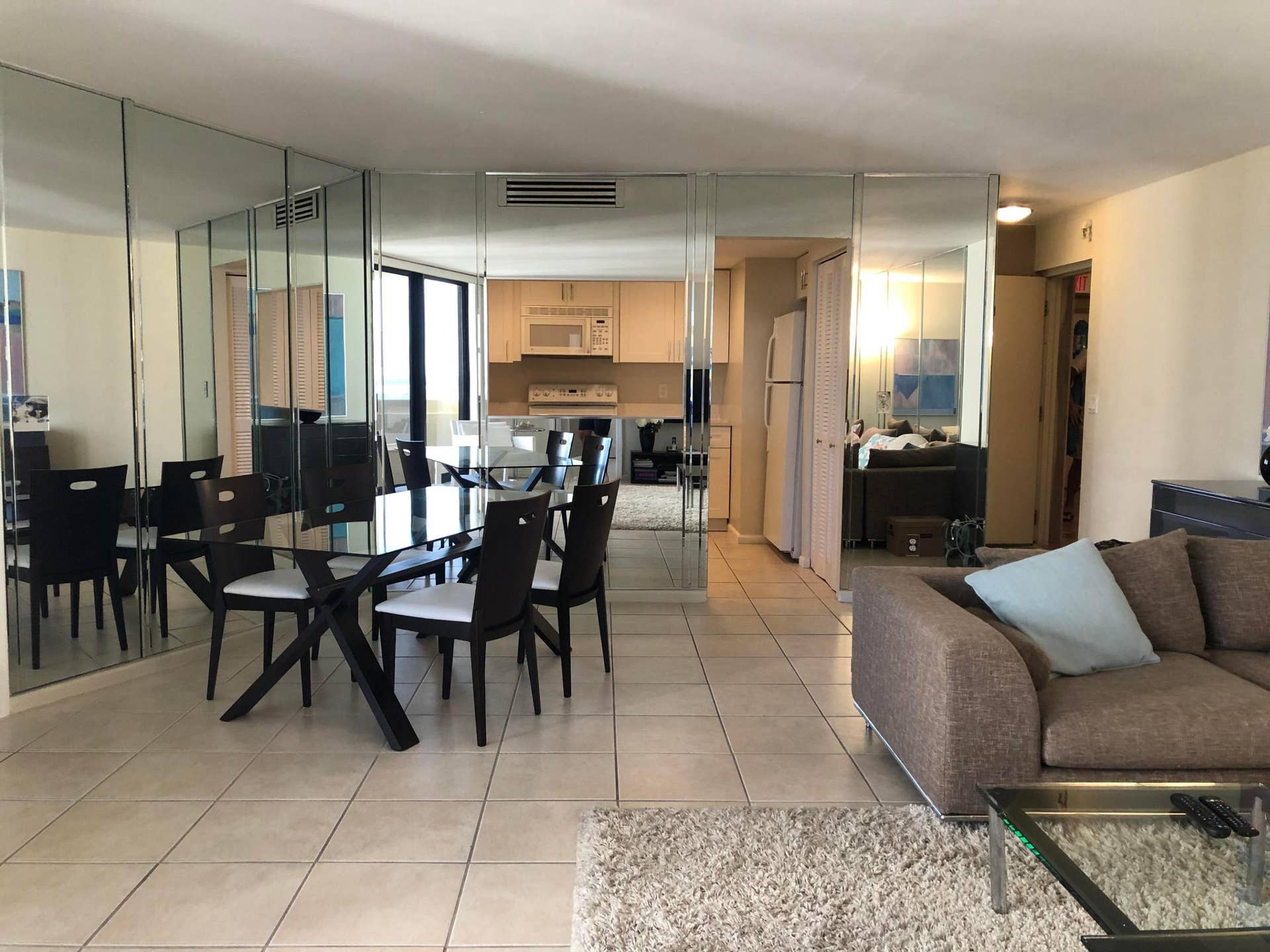 Tiled flooring extends throughout the living and dining areas