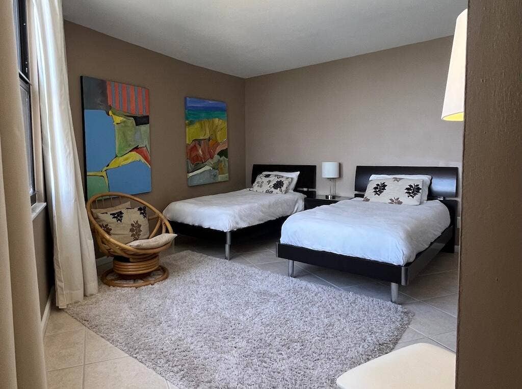 Tile flooring with a light-toned area rug