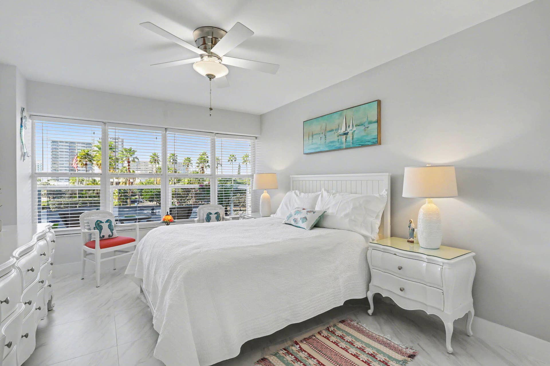 Spacious primary with seating area and bright abundant natural light