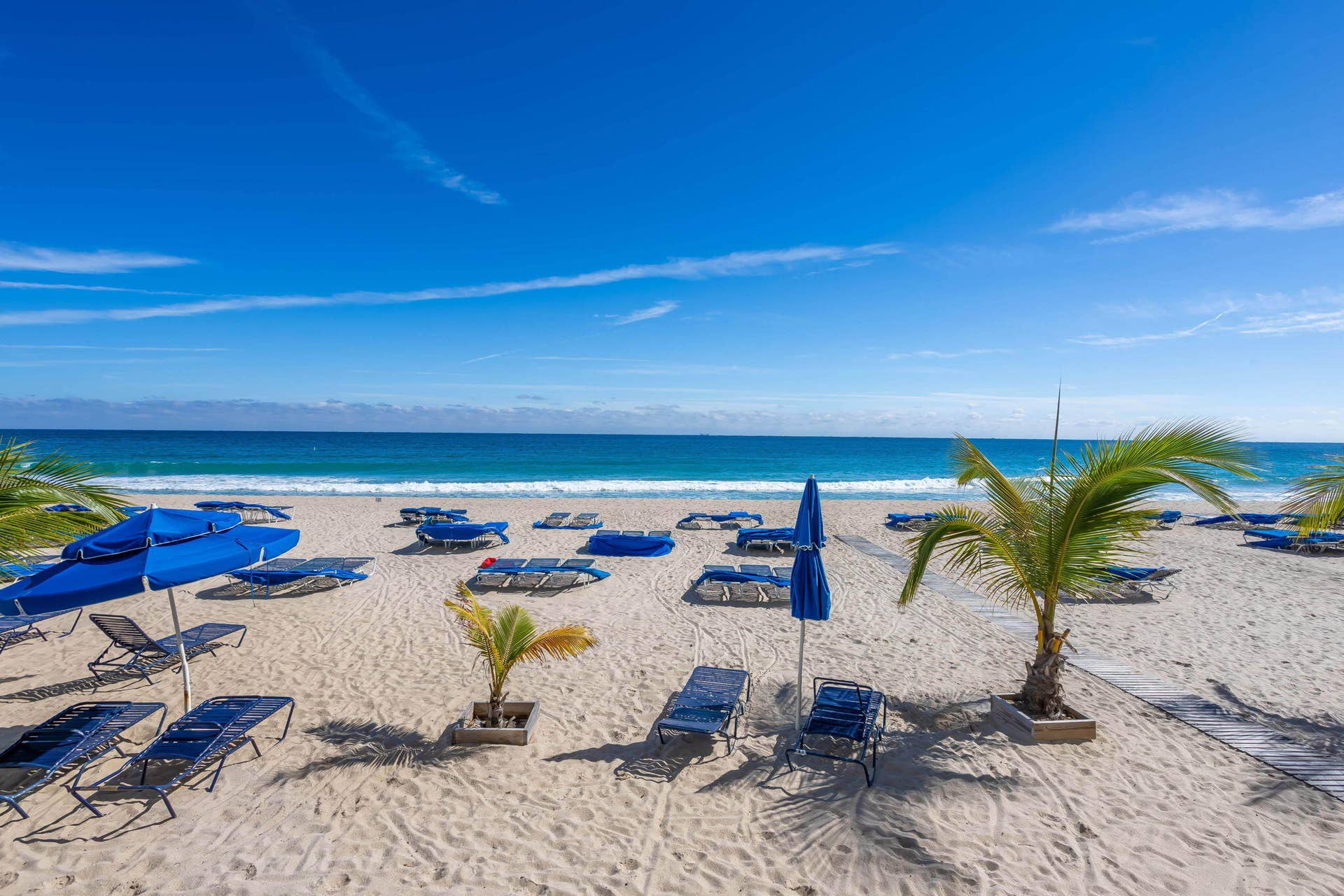 Live like you are on vacation on your private beach equipped with lounge chairs, umbrellas and ocean breezes