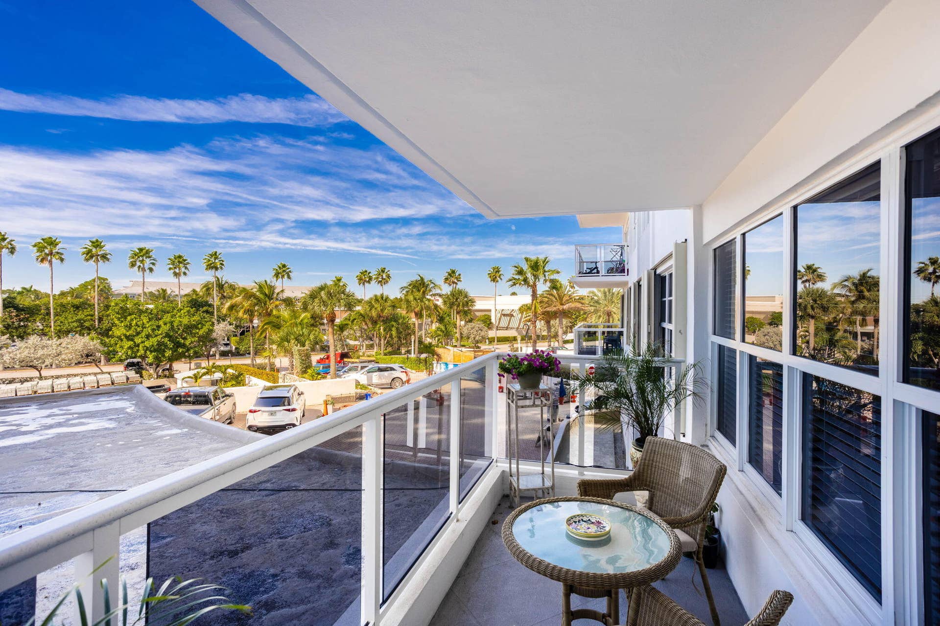 Private glass enclosed balcony to enjoy morning coffee, daily sunsets and beautiful ocean breezes