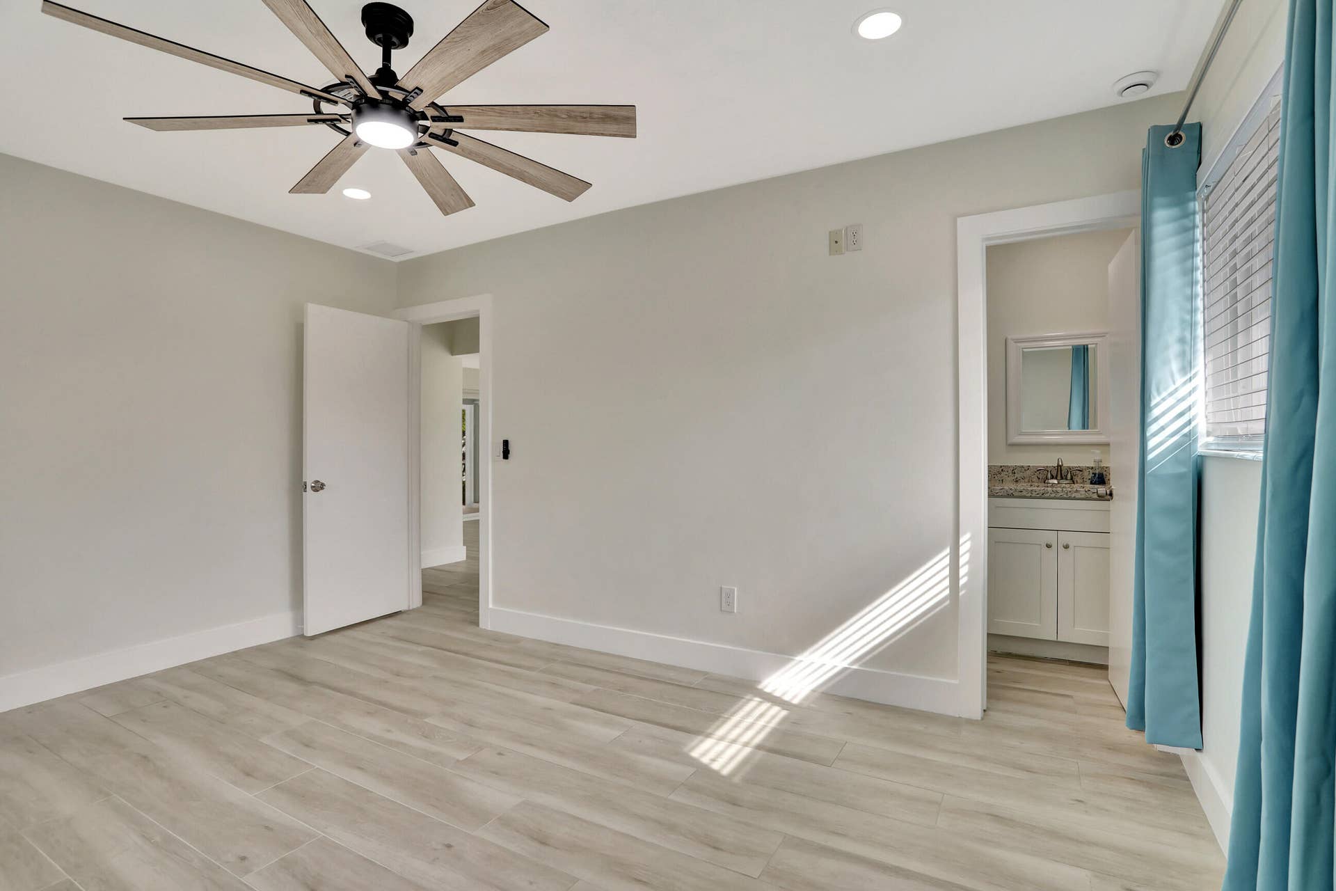 421 SE 5 Terrace, Pompano Beach, FL 33060 Bedroom 2 but can be primary suite. Has a full bathroom inside, storm windows and new large light and fan. High hat lighting.