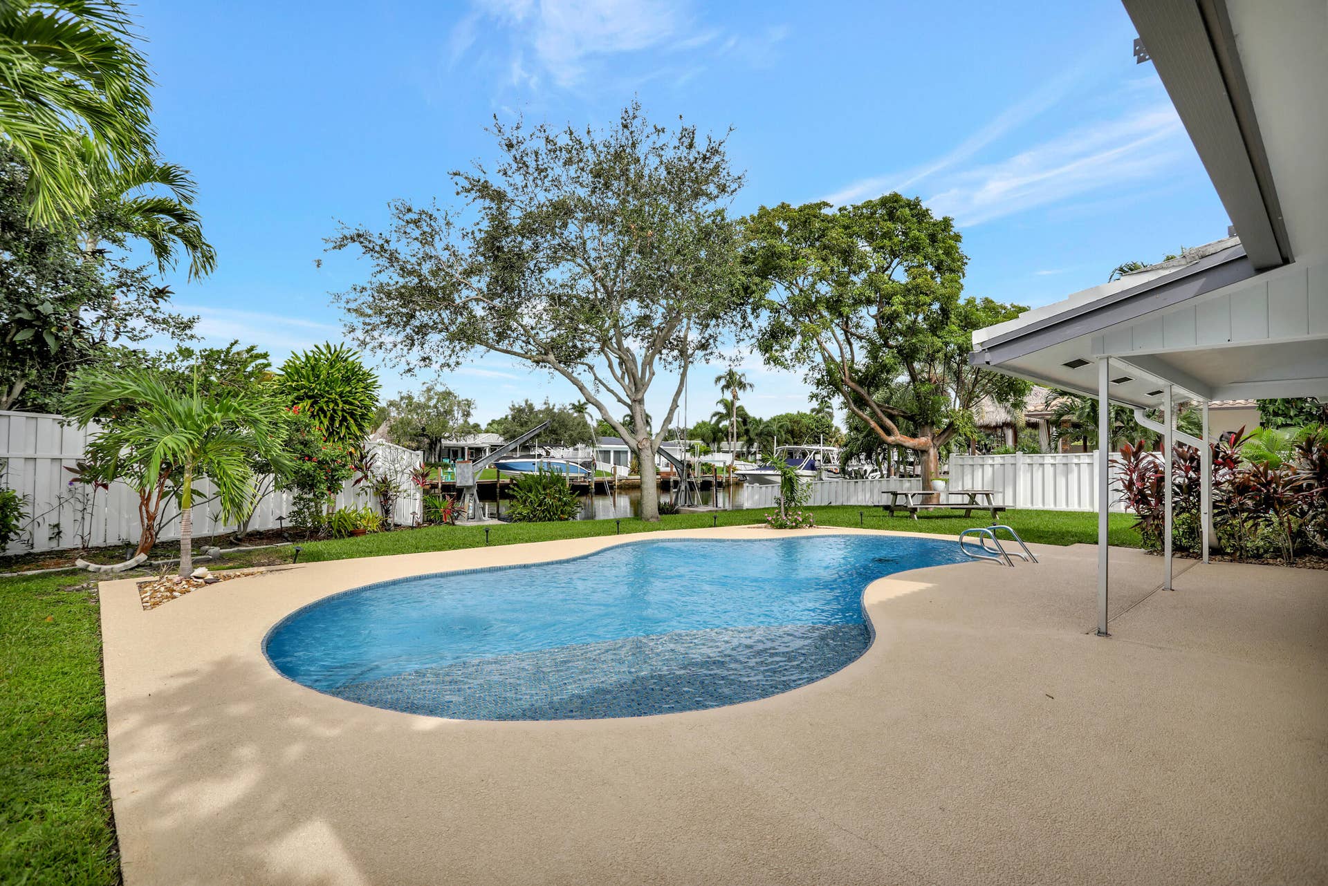 421 SE 5 Terrace, Pompano Beach, FL 33060 Large pool deck and part of covered patio shown.