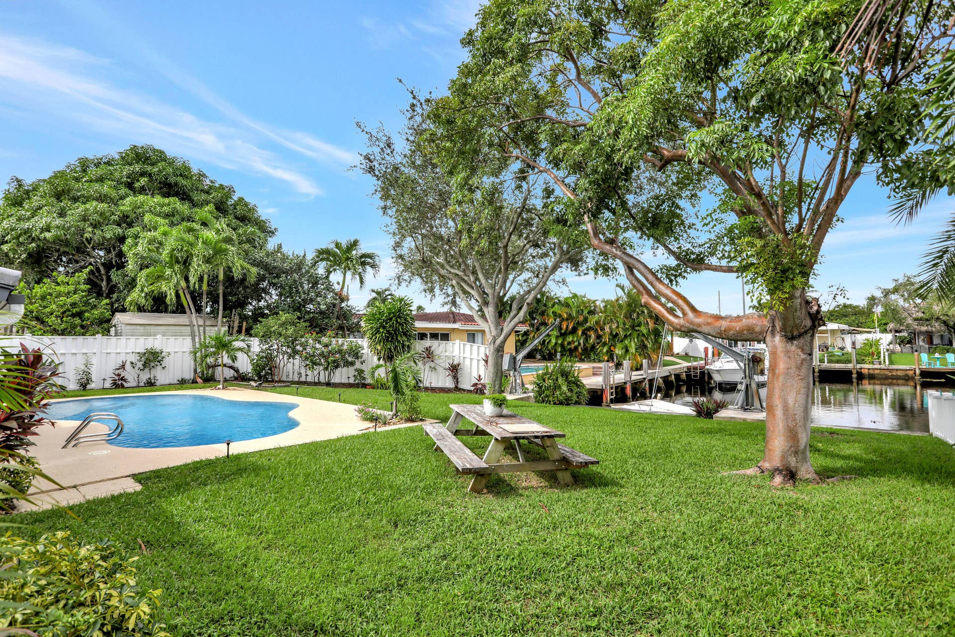421 SE 5 Terrace, Pompano Beach, FL 33060 Pool and water views from side at privacy fence.