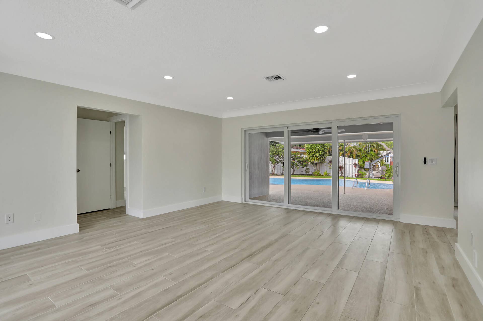 421 SE 5 Terrace, Pompano Beach, FL 33060 Living room leading to the pool and patio.