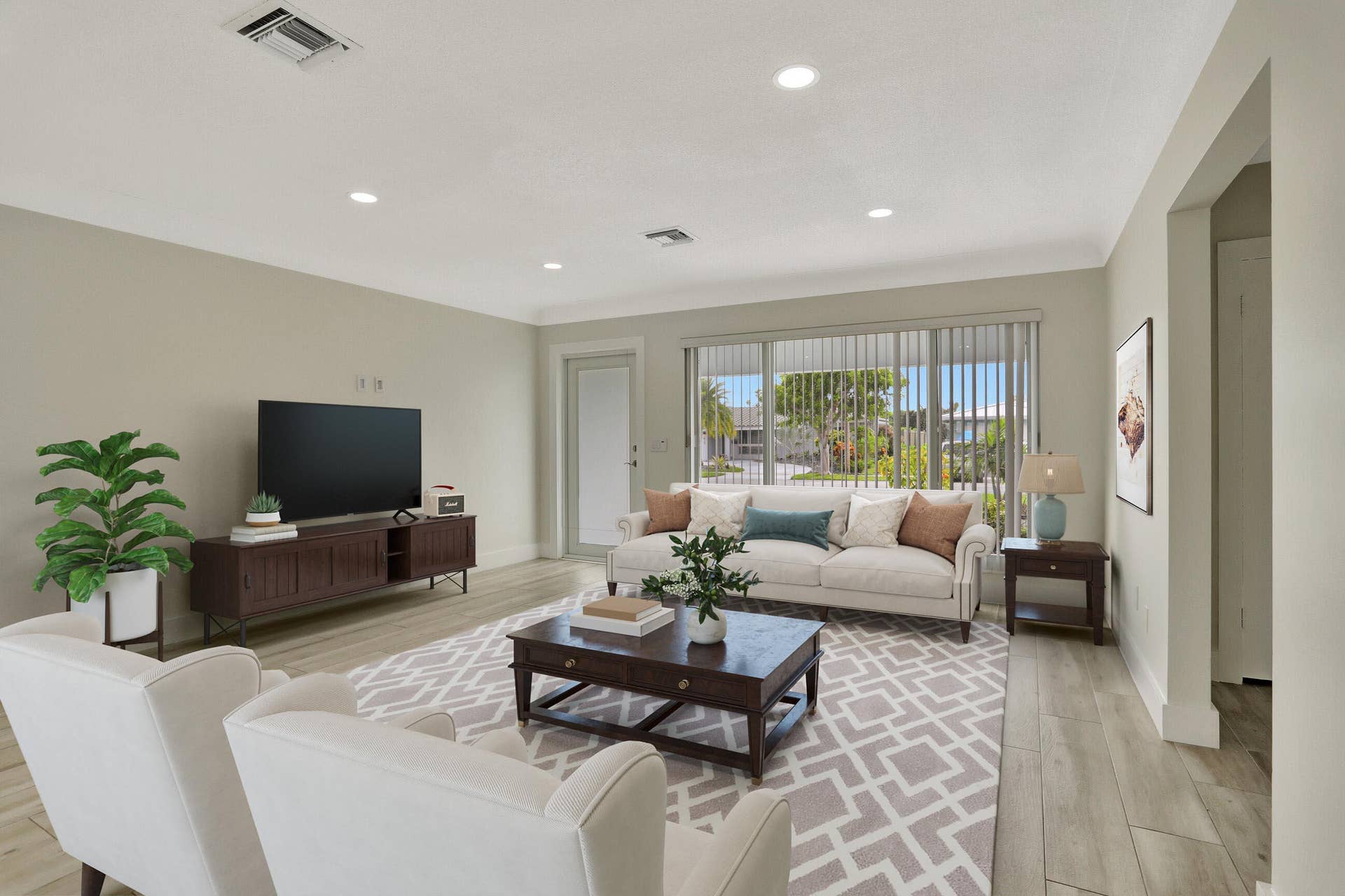 421 SE 5 Terrace, Pompano Beach, FL 33060 Living room leading to covered patio/pool. This photo is virtually staged.