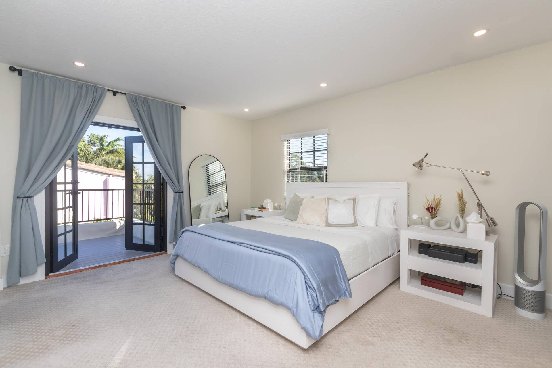 Master bedroom with two large closets, private bath & balcony