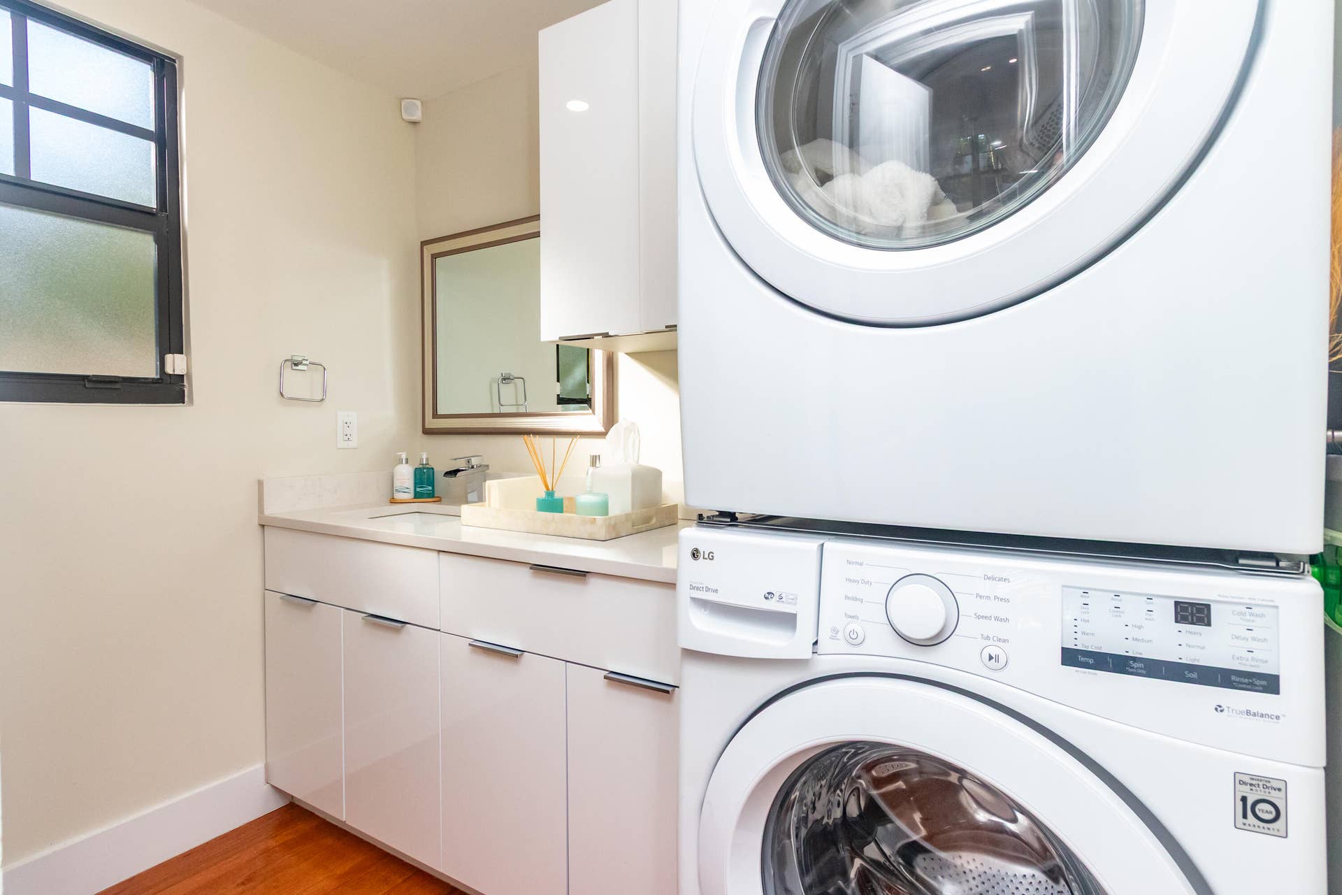 First floor half-bath doubles as a convenient interior laundry room