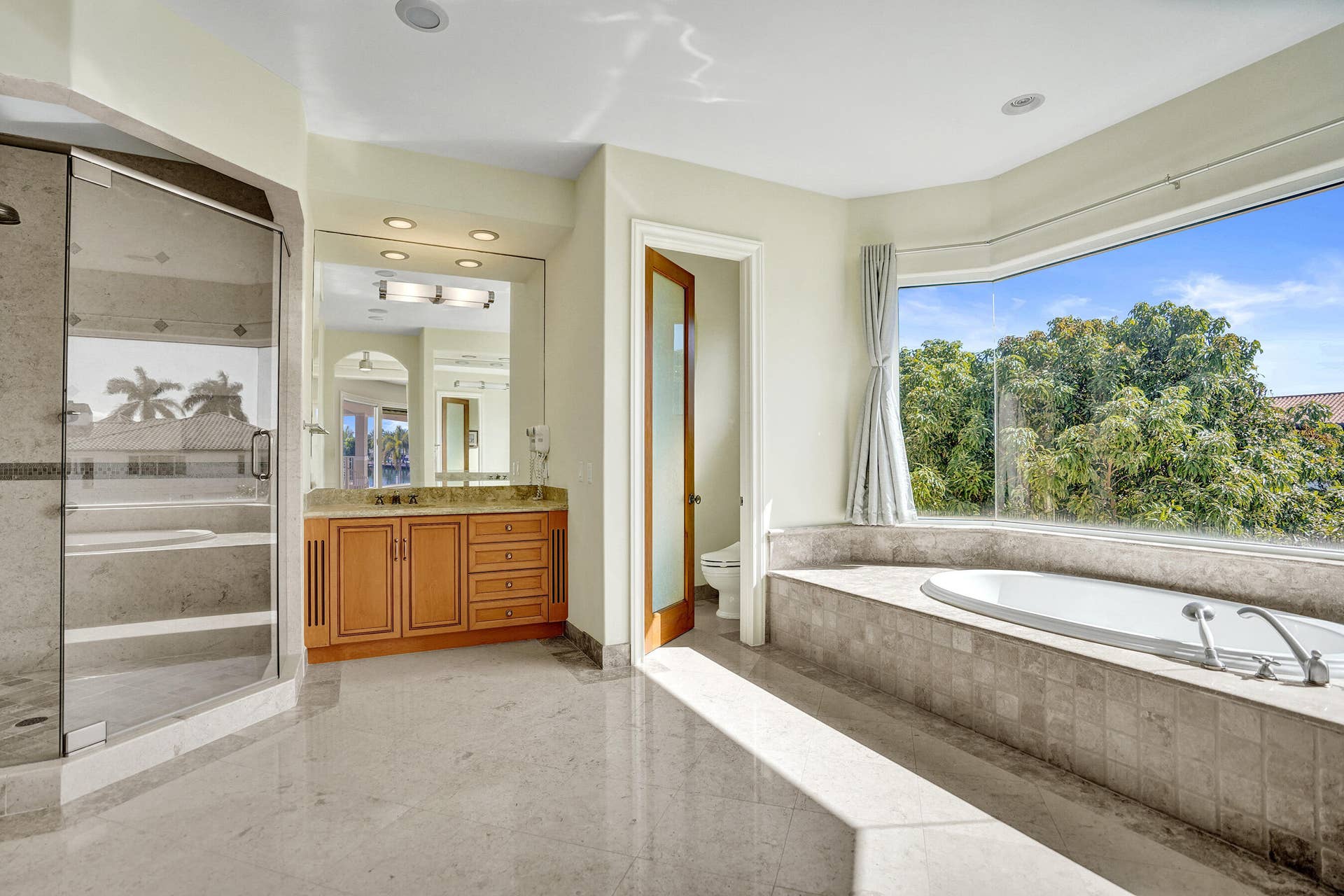 Owner's Primary Ensuite 1 with Dual Water Closets w/Bidet, Whirlpool Tub, Shower, & Dual Vanities Second Floor