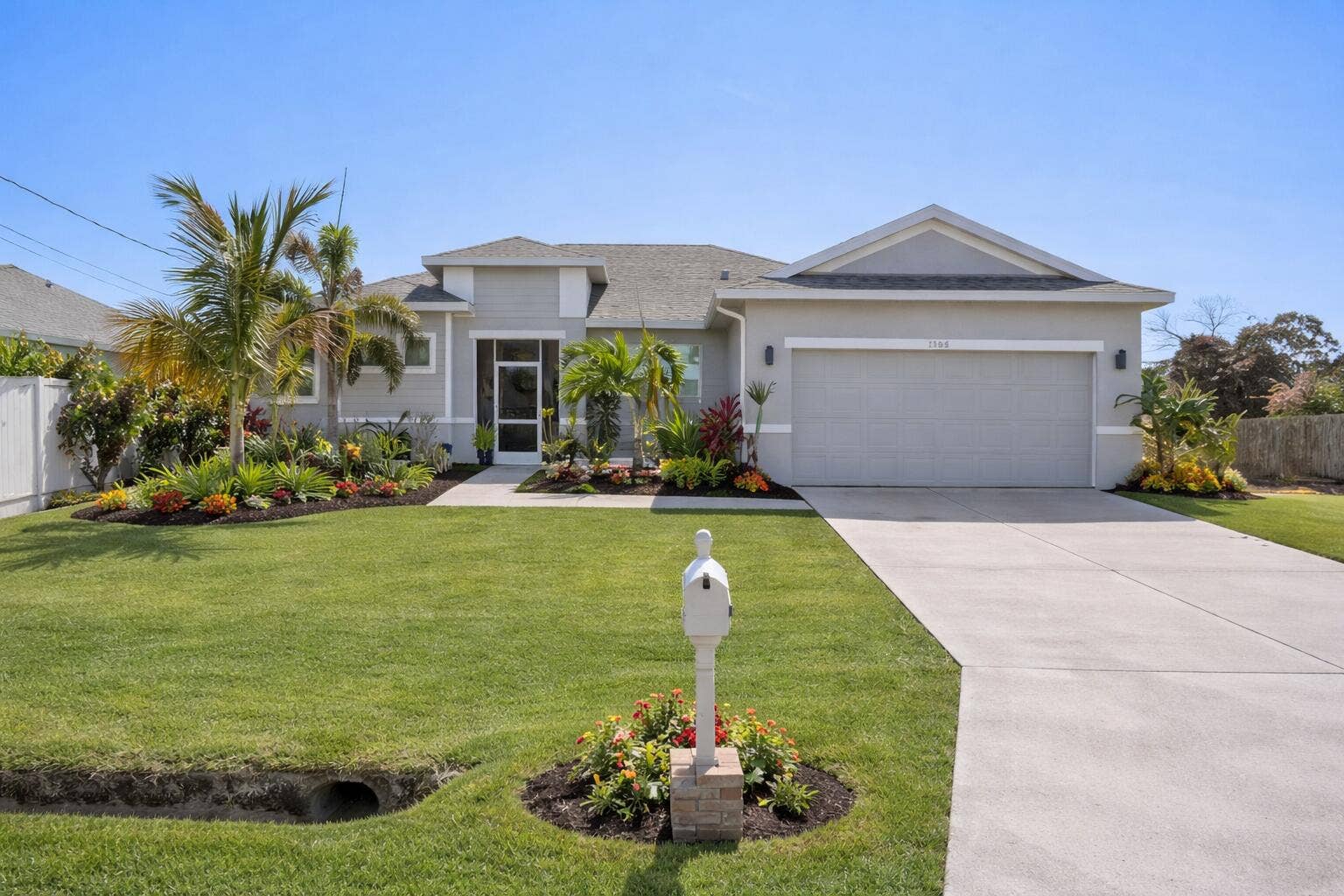 1568 SW Abacus Avenue, Port St Lucie, FL 34953 Homes landscaping has been virtually improvised