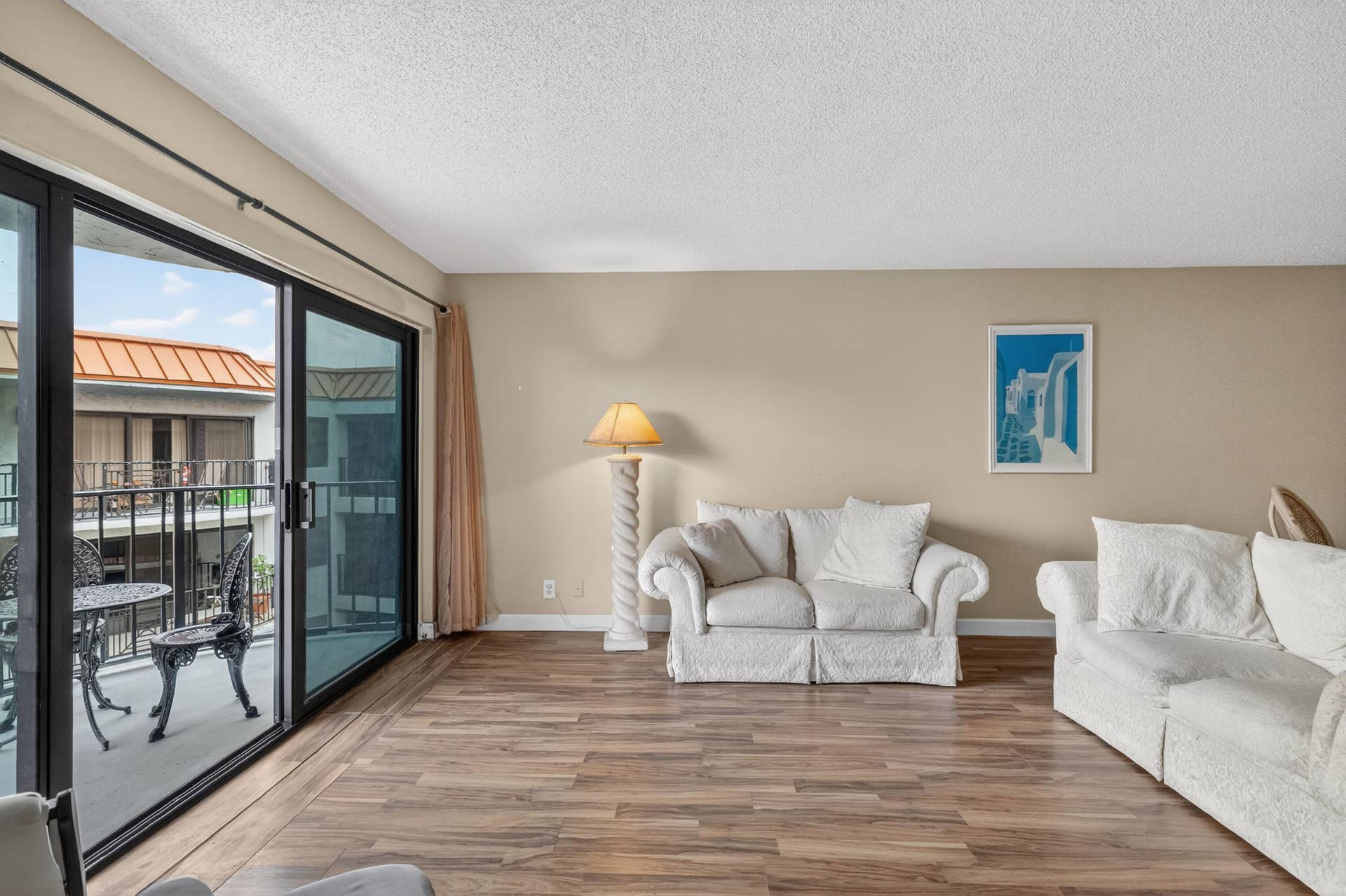 Wall of sliding glass doors to balcony