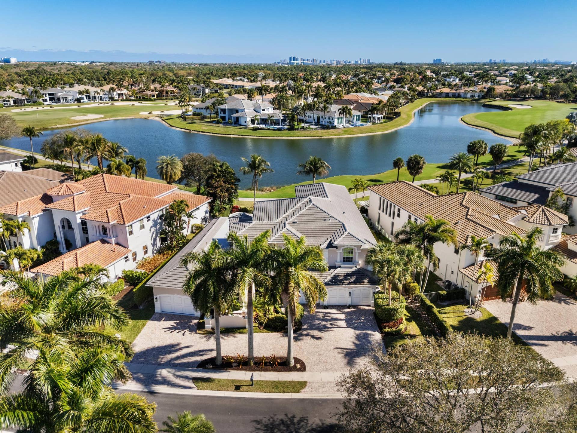432 Savoie Drive, Palm Beach Gardens, FL 33410 Ideally located between Hole #14 and Hole #15 with lake inbetween