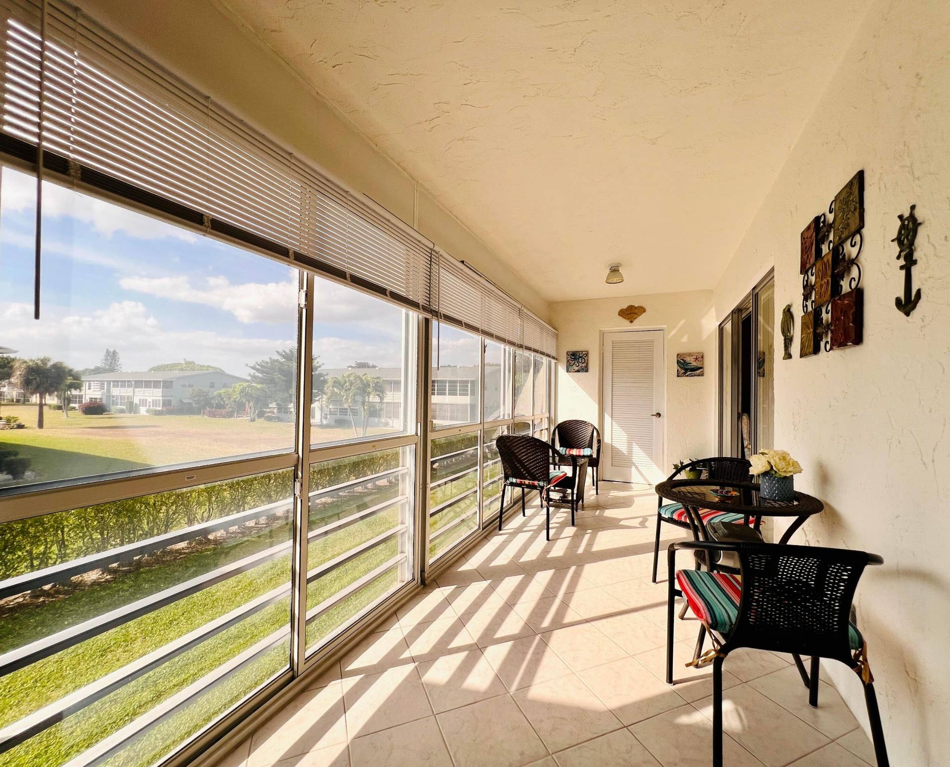 203 Oxford 500, West Palm Beach, FL 33417 Long Lanai With Tile Flooring and Large Storage Closet With Dryer