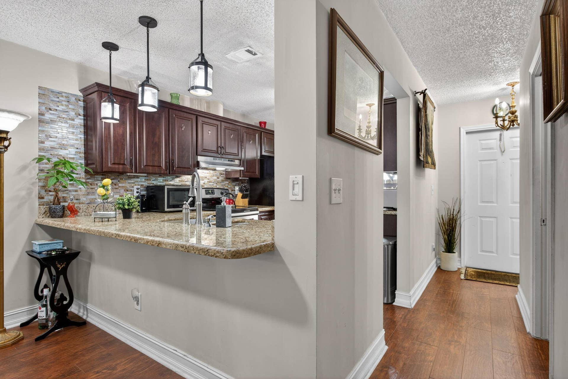 Pendants over extented counter for seating and entertaining