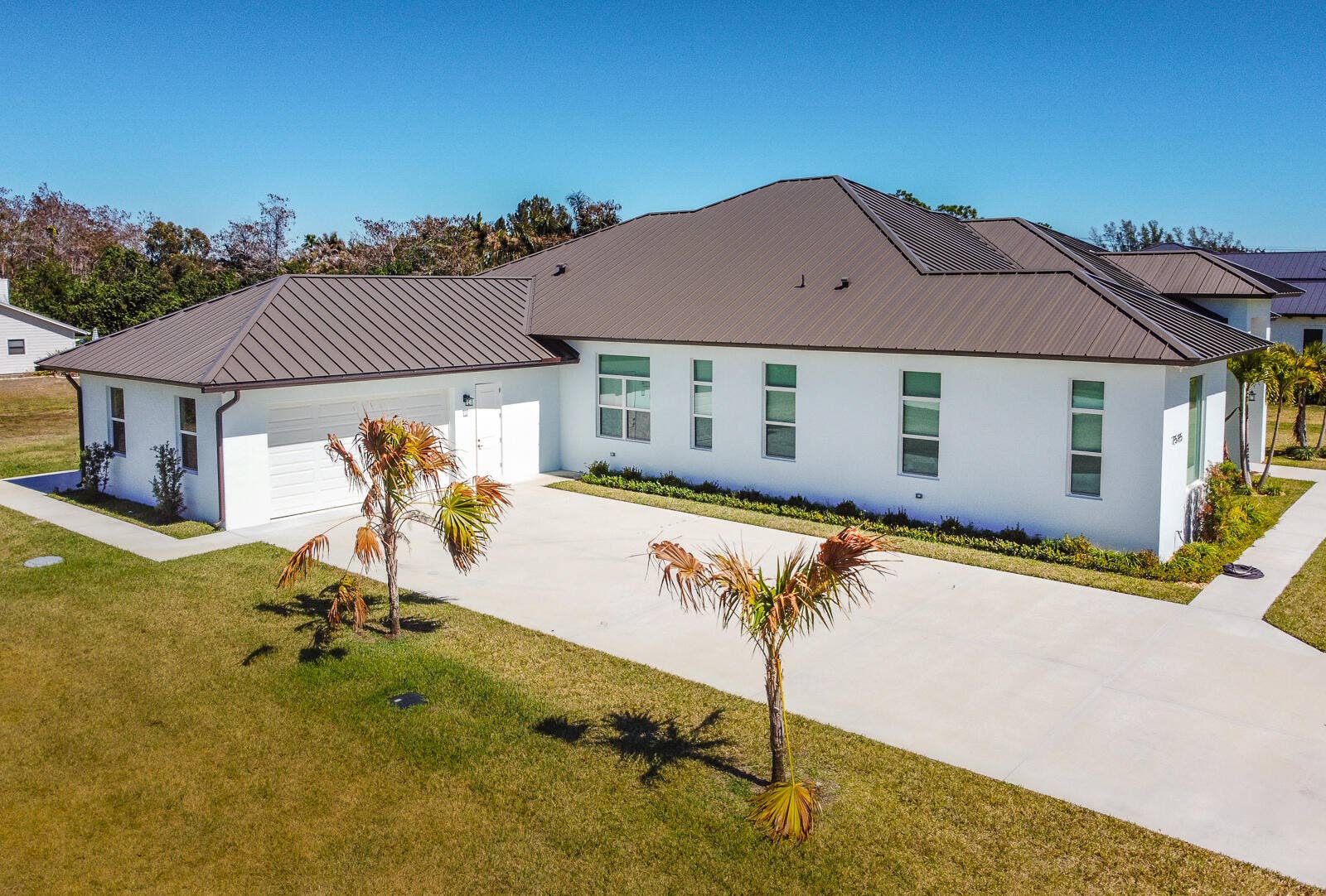 7595 155th Place N, Palm Beach Gardens, FL 33418 06-Front Exterior